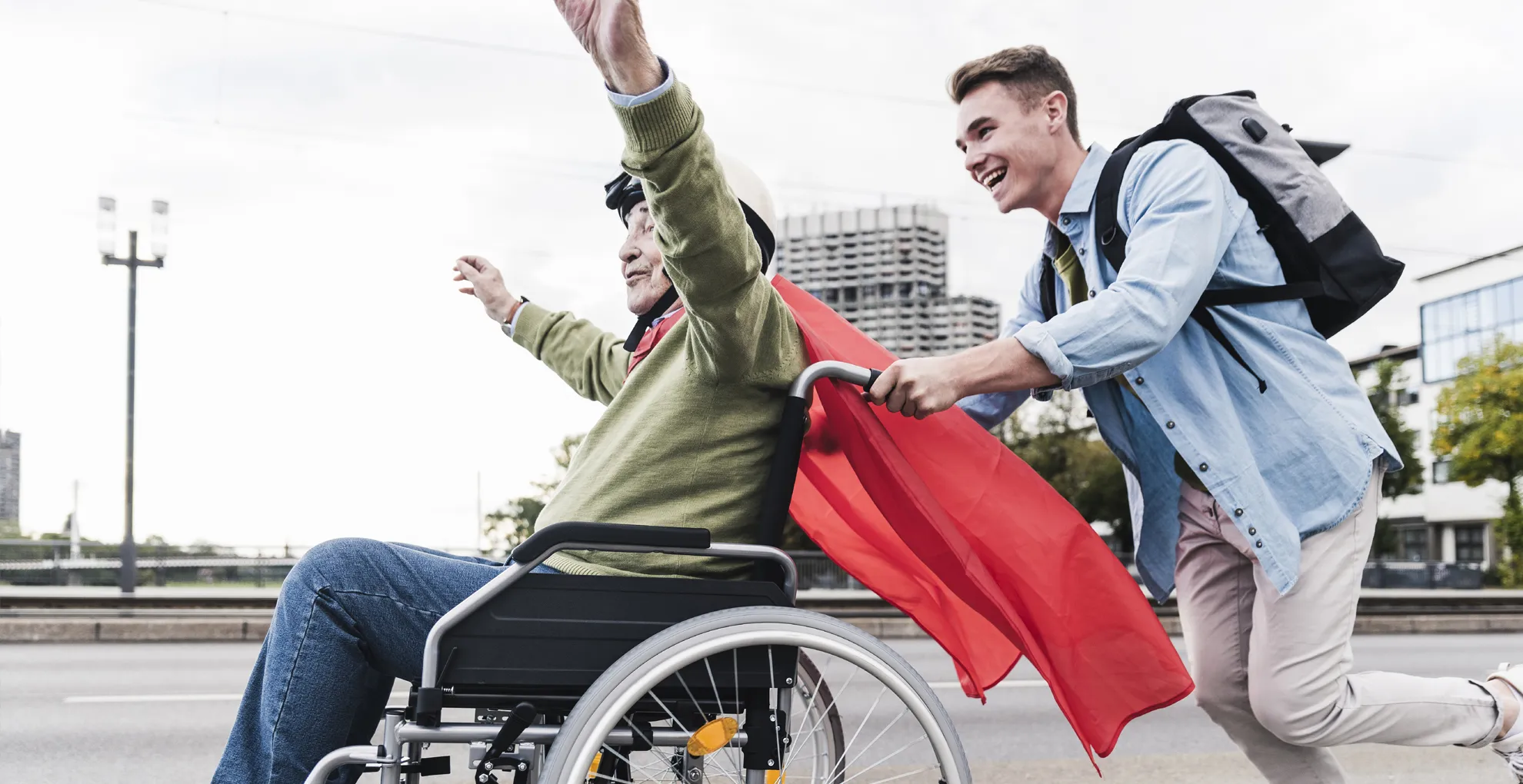 Participant in a wheelchair with a support worker outdoors