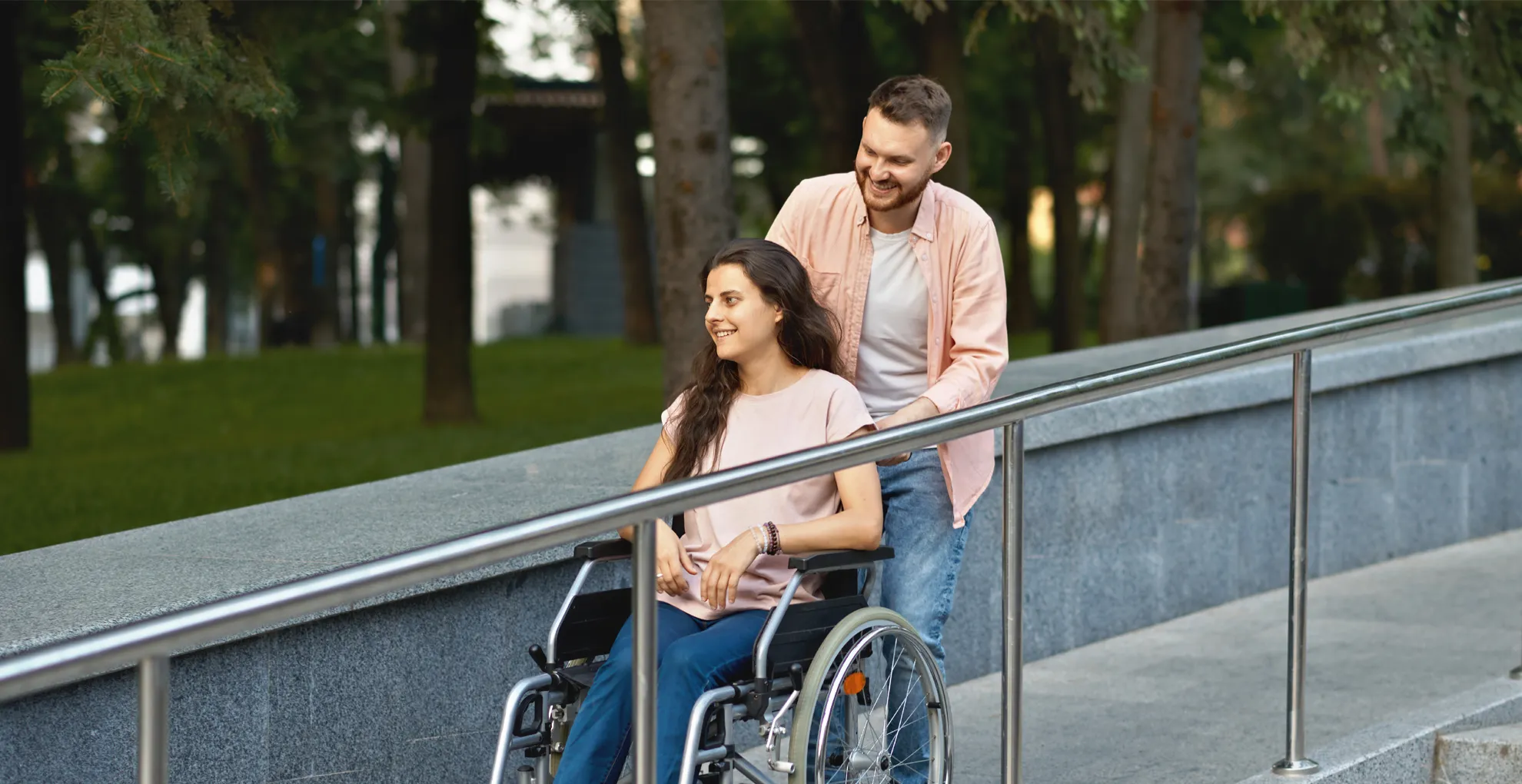 NDIS Provider Beaudesert 1 Support worker and participant in a wheelchair talking